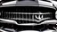 Placeholder: Photograph of a the front grill of a gorgeous, expensive, oldschool black muscle car with a big, black front grill, realistic, stylish, taken up close, symmetrical