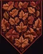 Placeholder: autumn colored cloth banner with embroidered ornamental leaves and filigree, using thick tread