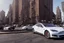 Placeholder: A Tesla 'Model S' is parked, near the Flatiron Building in Manhattan. (CINEMATIC, WIDE ANGLE LENS, PHOTO REAL)