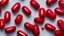 Placeholder: a bubble pack of red pills, next to torn red ribbon, on a white background
