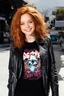 Placeholder: Debby Ryan, smiling, Heavy Metal t-shirt, Black Leather biker's jacket, midday, bright sunlight, extremely colorful. Big, fluffy hair, Debby Ryan has Auburn Red hair, green eyes, She is extremely well built.....Well endowed.