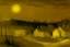 Placeholder: A small yellow village with lightbulbs painted by Albert Pinkham Ryder
