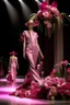 Placeholder: Model in runway with pink orchids like principal elements and element that recall olives trees and palm