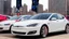 Placeholder: A Tesla's 'Model S Plaid' is racing at top speed, on the Navy Pier, in Chicago. CINEMATIC. WIDE ANGLE LENS. PHOTO REAL.