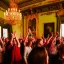 Placeholder: Celebration in a schloss, cheering people, Austrian aesthetic, warm colors, wooden floor, forest green walls, red, chiaroscuro, 8k, HD, cinematography, photorealistic, Cinematic, Color Grading, Ultra-Wide Angle, Depth of Field, hyper-detailed, beautifully color-coded, insane details, intricate details, beautifully color graded, Cinematic, Color Grading, Editorial Photography, Depth of Field, DOF, White Balance, 32k, Super-Resolution, Megapixel, ProPhoto RGB, VR, Halfrear Lighting, Backlight