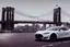 Placeholder: A Tesla's 'Model S' is racing at top speed, on the 'Brooklyn Bridge' in New York. CINEMATIC. WIDE ANGLE LENS. PHOTO REAL.