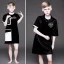 Placeholder: Russian short hair beautiful tomboy boyish boylike short man's haircut boyish features shortcut in black girlish nightgown in hotel wedding night