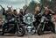 Placeholder: a very hard and tuff motorcycle young gang with viking hair, not old, posing with their Harley Davidsson bikes, some of them holding guns and shotguns, a logo sign with "FALKÖPING HD", "FEARLESS SINNERS" Skulls and bones, skeletons and fire, Sweden vikings DEMONS, Swedish flags on bikes