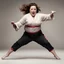 Placeholder: Melissa McCarthy using some martial arts moves