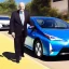 Placeholder: Jim Cramer driving Toyota Prius