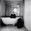 Placeholder: Lee Miller, the intrepid war photographer, finds herself standing in Hitler's bathroom. She lies in the bathtub camera hangs at her side, a silent witness to the solemn moment.