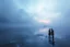 Placeholder: splash screen, alien landscape with a couple , iced lake, fog, cold colors, metallic tones, scifi style, fade colors, utopistic vibe