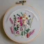 Placeholder: embroidery hoop with delicate embroidery and beadwork of flowers, pressed flowers, tulle, couture, beautiful composition, aesthetic layout, wildflowers, detailed beadwork, beading