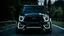 Placeholder: A (((G-Wagon mustang))) featuring a luxurious interior, advanced technologies, and a sleek body kit designed by MANSORY, front cinematic view on road in morning