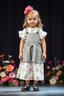 Placeholder: 3 years old german girl with fashion modern clothing in stage with flowers