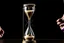 Placeholder: A picture of a person holding an hourglass, symbolizing the importance of time management.