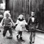 Placeholder: Creepy old photo of rainbow zippy monster chasing children at new year