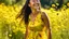 Placeholder: A young African American woman with long, braided black hair, wearing a vibrant yellow sundress, laughing joyfully in a sun-drenched meadow filled with wildflowers during a warm summer afternoon.