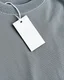 Placeholder: Blank tag on sweatshirt, top view. Space for text