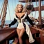 Placeholder: Sandra Dee in agent provocateur on a pirate ship. There is a deer in a tuxedo.