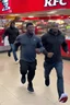 Placeholder: 200 black men running into a KFC chicken restaurant doing everything to get chicken pure chaos. birdseye vieew