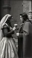 Placeholder: An old picture style of black and white mono very bad quality looks very old camera picture of Romeo is giving a rose to Juliet both dress as royal year 1400