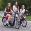 Placeholder: 4 girls in 2 bikes