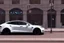 Placeholder: A Tesla 'Model Y' is going at a high speed, near the building of the 'Friends' series in New York. (CINEMATIC, WIDE ANGLE LENS, PHOTO REAL)