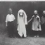 Placeholder: old photo Eerie ghost dog with people