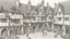 Placeholder: A Paved Courtyard, With Tudor Gothic Houses, Tall twisted Chimneys, warped Rooves, People, Shops,