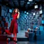 Placeholder: make a picture pretty stage made of metallic blue-gray teme 3d recursive cubic and sphere and cylinder base structures and a beautiful fashion model lady posing with cute in black and white and the scene is in color,with dark red top and pretty pleated midi skirt ,makeup curvy long hair,dynamic camera zoom to full body and pan, dynamic lights.