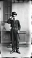 Placeholder: An old picture style of black and white mono very bad quality looks very old camera picture with cracks Charlie Chaplin , year 1900