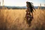Placeholder: (in the style of Orion, by Masamune Shirow) Subject: A raw, unfiltered, full-body analog photograph captured from behind, focusing on a young Native American woman. She stands tall in a vast, dense field of golden-brown and sun-bleached wild grasses that reach up to her waist. Her skin is warm, bronzed by the sun. Her dark hair is braided in two thick, traditional plaits that hang down her back, interwoven with beads and thin leather strips. She is looking back sharply over her right shoulder wi