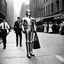 Placeholder: black and white photo by Helmut Newton: C3PO with a gorgeous Charleston brunette vintage photo 1923 in the streets of Manhattan after the premiere of a movie, a vintage style policeman is around, wide angle on the old street