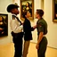 Placeholder: Mona Lisa comes out of the picture and kisses a young navy officer who is standing in the museum looking at her picture