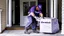 Placeholder: fedex driver with a chainsaw at the front door