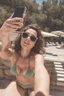 Placeholder: selfie of a woman in bikini