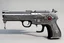 Placeholder: Demonic Pistol chrome with gadgets and accessories and antechrist symbols system, it is in its bone box with ivory and devil symbols