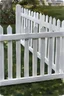 Placeholder: white fence in yard, photograph