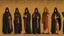 Placeholder: hooded monks in black robes in egypt