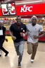 Placeholder: 200 black men running into a KFC chicken restaurant doing everything to get chicken pure chaos