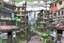 Placeholder: TLOU Town but as a coloured manga style, no characters just city landscape. in the style of Tatsuki Fujimoto