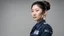 Placeholder: asian female police officer with beautiful face, bun up hair, full body looking to the left