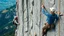 Placeholder: elderly men and women rock climbing, detailed colour photograph