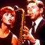 Placeholder: REd-haired Ron howard Is richie from happy days playing the saxophone with his "eyes closed", rock band, embouchure, looking at camera, woman