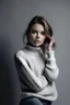 Placeholder: an image of a female model in a knitted sweater and jeans. light grey background. fashion style photo