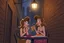 Placeholder: iconic lady and the tramp eating spaghetti in an alleyway under a streetlight, cartoon, disney, romantic