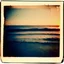 Placeholder: Photographic, Sea, soft waves, polaroid with damaged border, 1968, sunset, scotch tape on the border, scribblings, Coffee stain