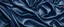 Placeholder: Beautiful dark blue silk satin background. Soft folds on shiny fabric. Luxury background with space for design. Web banner. Flat lay, Table top view. Christmas, Valentine's Day.