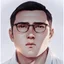 Placeholder: mysterious youthful Russan male, man,A man's face, dark and intriguing, confident, intense, handsome, anime style, retroanime style, cool style, dark black short hairs, Caesar cut style hairs, white shirt, squea glasses for vision, white man, black brown eyes, middle lips, A small smile, The head looks straight ahead